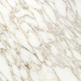 Calacatta gold marble texture with bright white base and thick, meandering beige and gold veins, polished reflective surface.